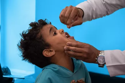 Children while being vaccinated at Al Olfi Health Center by health workers