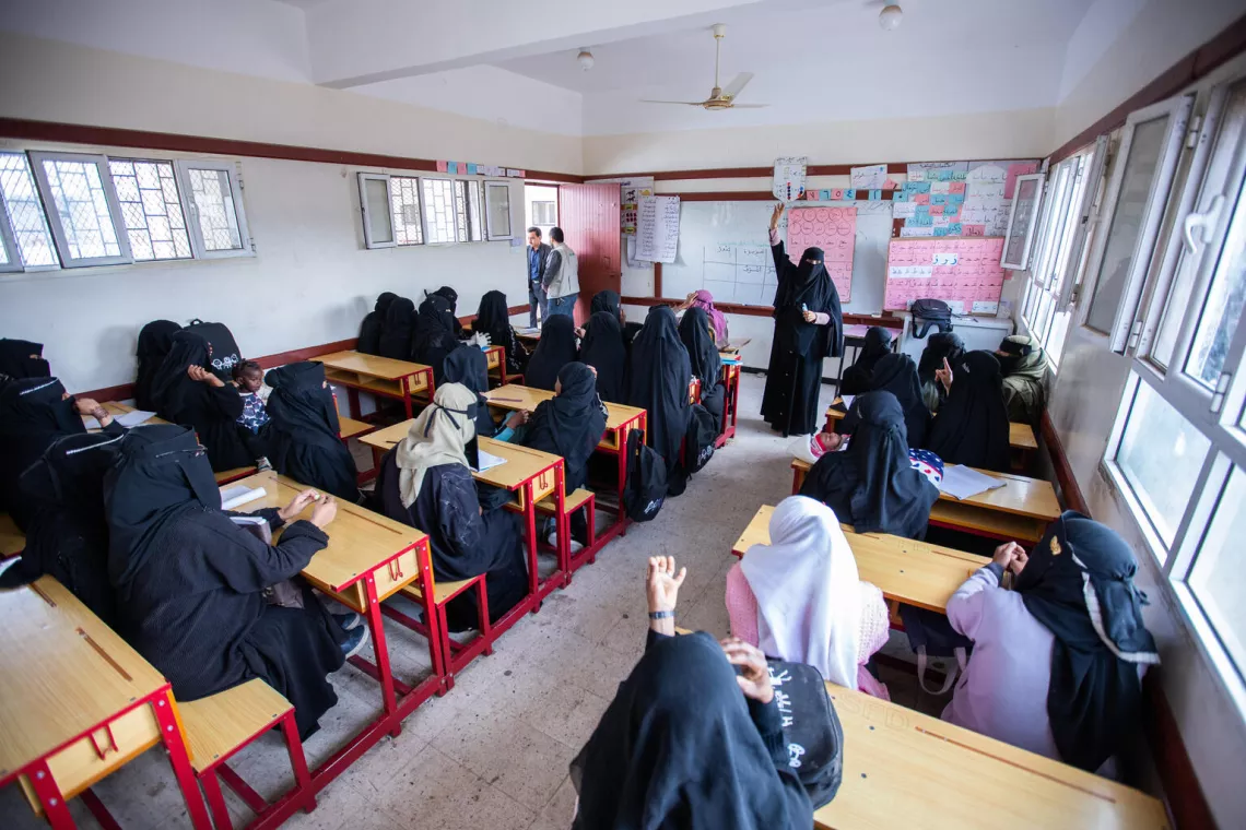Girls attending basic literacy and numeracy lessons in a classroom in Yemen