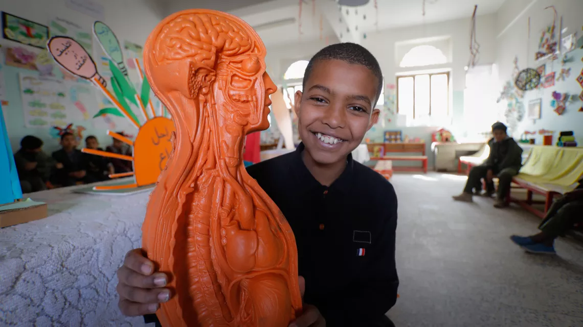 a boy with a human body model