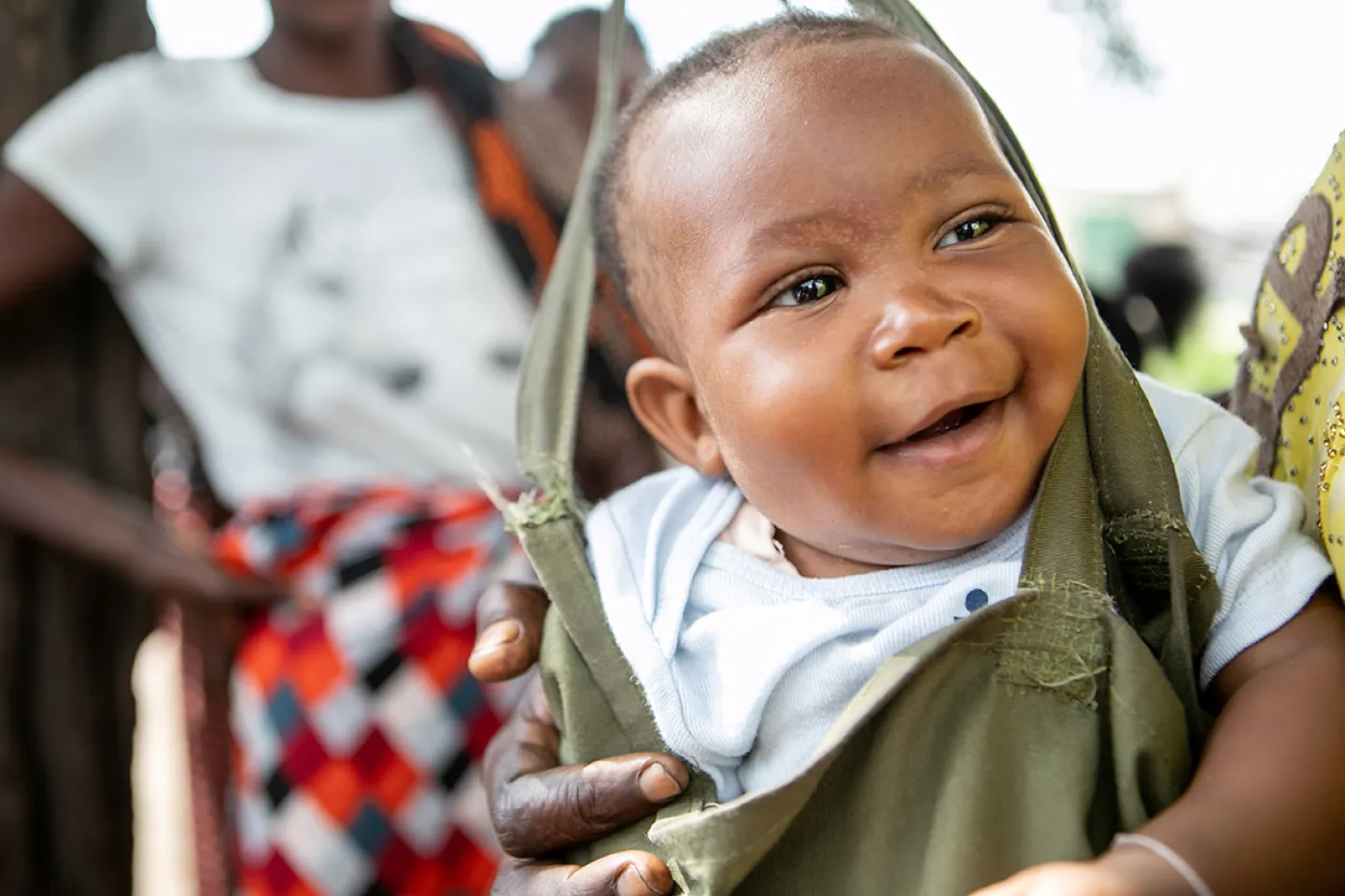 A boy smiles during growth monitoring at a clinic in Lusaka, Zambia