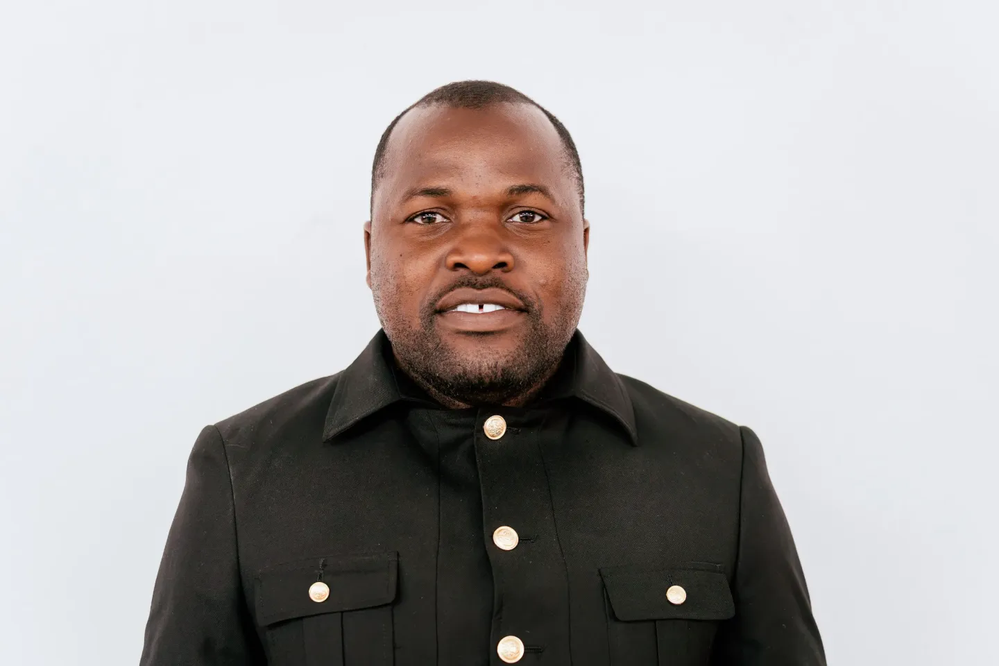 Collins Chipasa, Head of the Mathematics Department and ICT teacher at St. Monica's Girls' Secondary School, poses for a portrait.