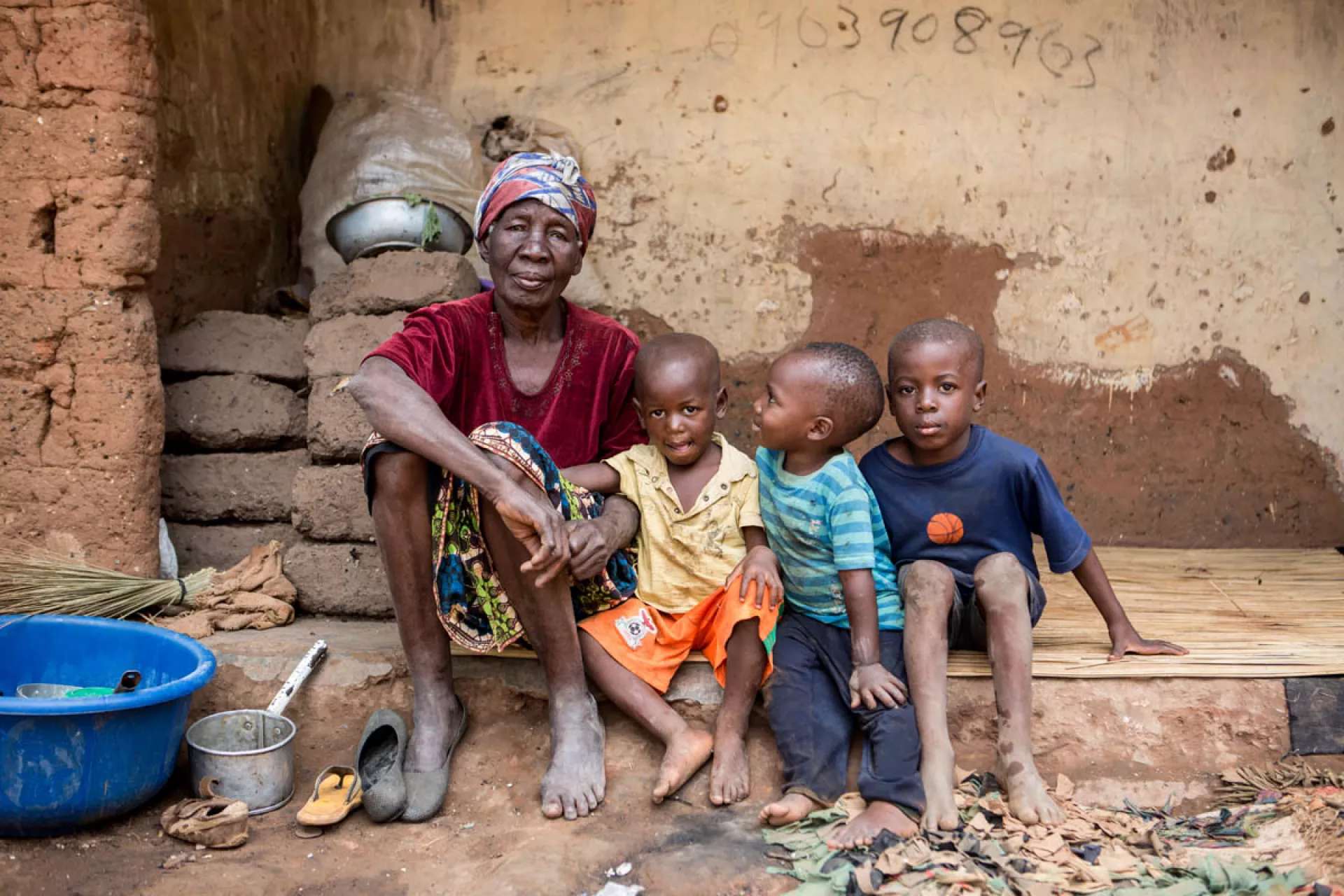 A grandmother and grandchildren outside  their home in Ndola, Zambia
