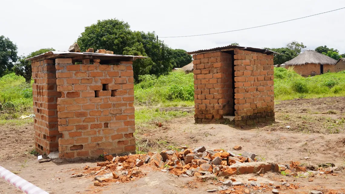 Before: Dilapidated pit latrines at a school before the construction of new sanitation facilities in Chifunabuli District, Luapula Province.