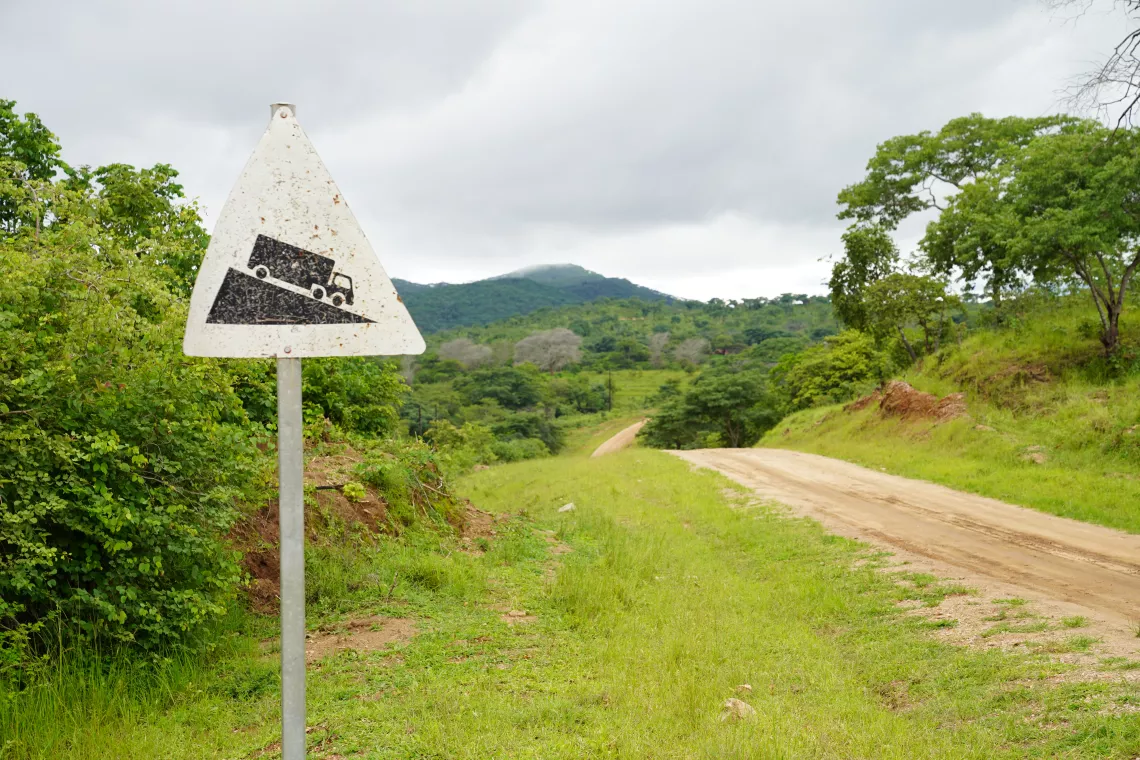 Road sign warning of downward slope in Gwembe District, Zambia