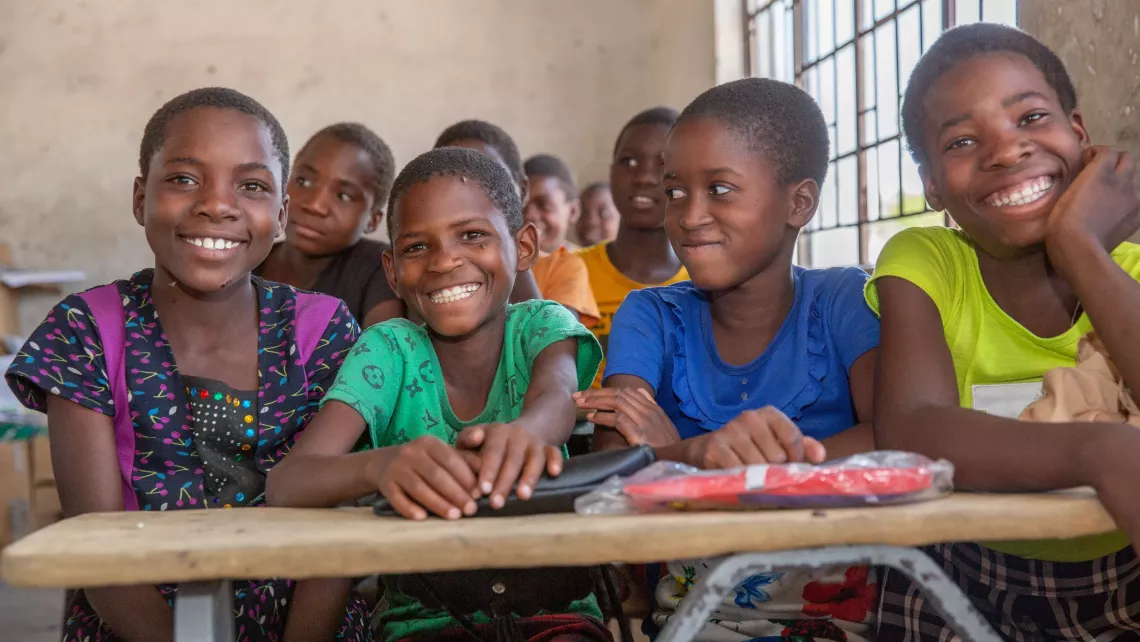 Students smiling in school.