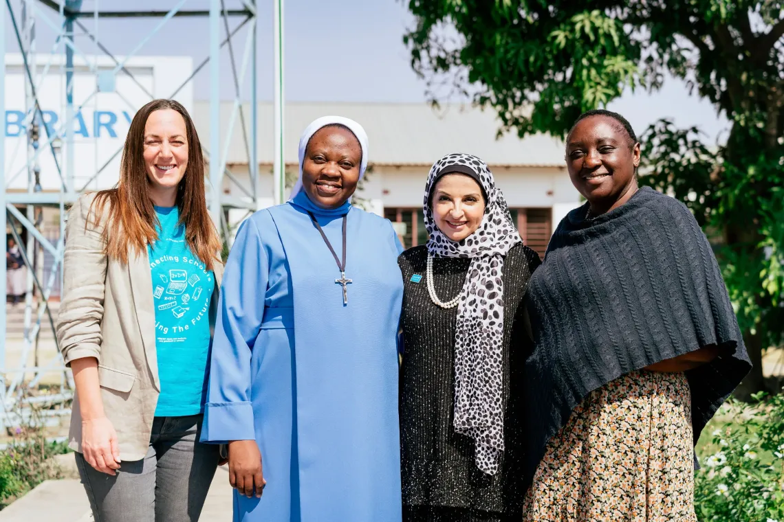 Representatives from the Ministry of Education, UNICEF and St. Monica's Girls' Secondary School pose for a group photo during a visit highlighting digital learning at the school.