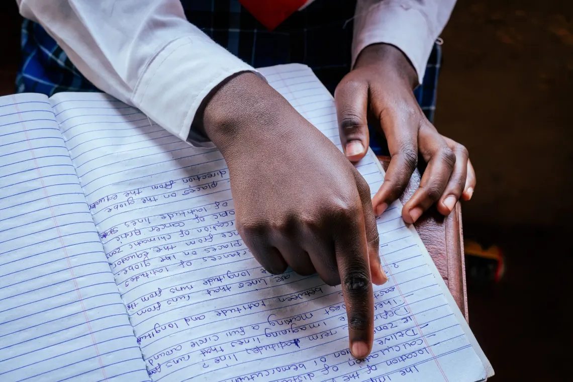 Hellen* sits behind her desk and proudly shares her favourite subject during the interaction.