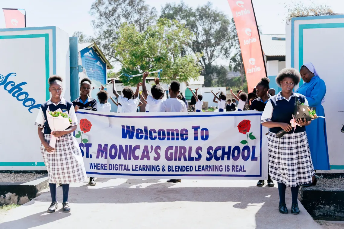 Learners welcome Ministry of Education, UNICEF and Airtel guests to St. Monica's Girls' Secondary School.