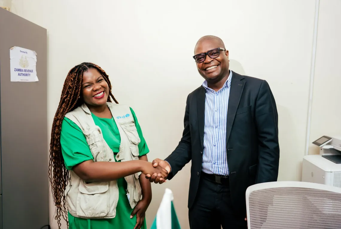 Tikulirekuti Banda-UNICEF, with Dr. Calistus Kayunga, Provincial Health Director, Southern Province. 