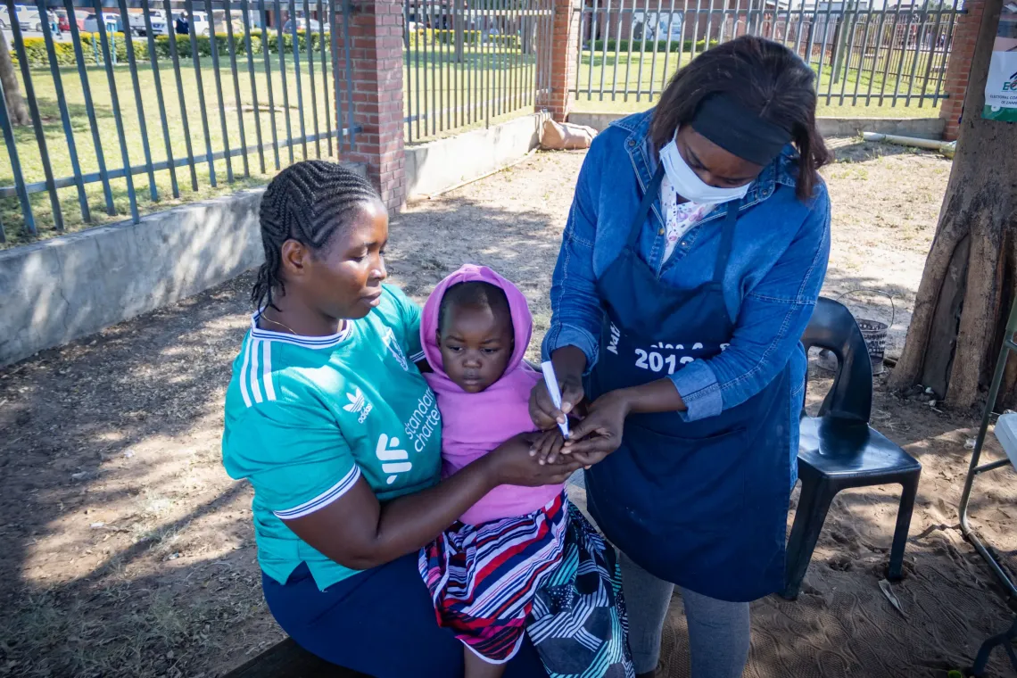 Memory Lutanga and her son Lubkmba Hachizibe at the border post in Sesheke