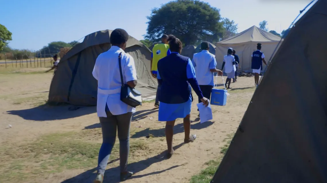 Healthcare workers walk through the camp in Senanga visiting each tent to administer polio vaccines to any under-five child in the tents.
