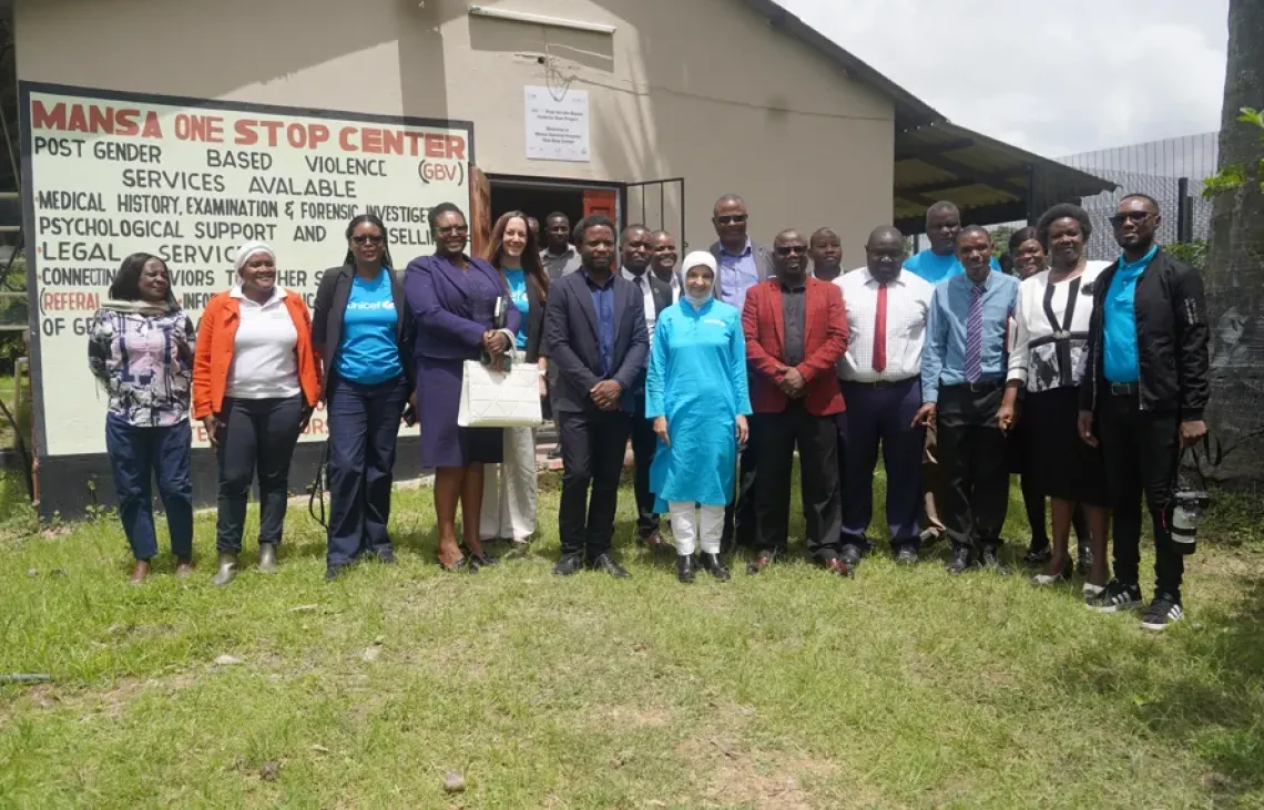 UNICEF, government officials and partners pose for a group photo outside the Mansa One Stop Centre in Luapula Province.