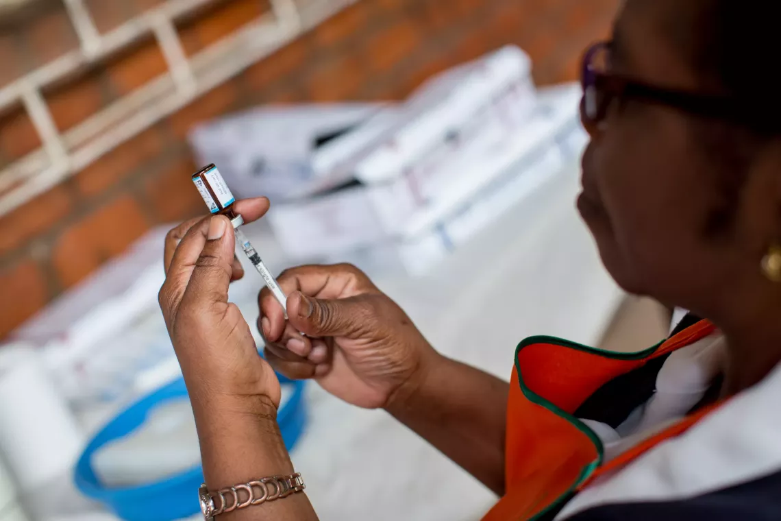 A nurse preparing an injection.