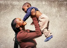 A mother shares a playful moment with her child during a polio vaccination campaign in Kanyama Compound, Lusaka, as families come together to protect children from polio and keep every child safe and healthy.