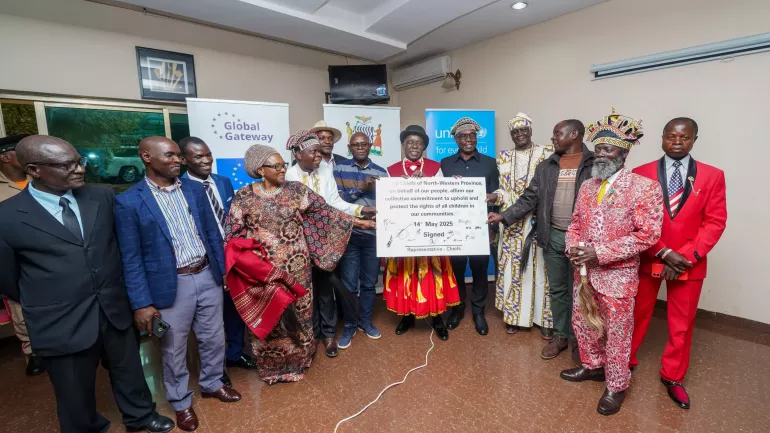 Traditional leaders from North-Western province proudly display their signed pledge demonstrating their commitment to protecting the health and well-being of children.