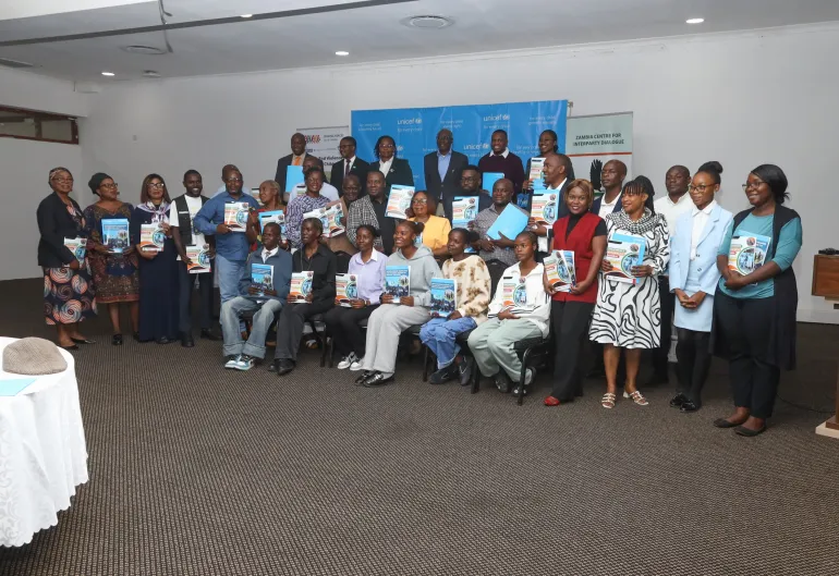 Children pose for a photo with representatives of political parties after presenting the national Children's Manifesto at a high-level stakeholder engagement in Lusaka.