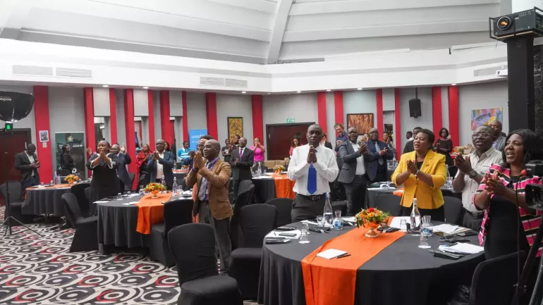 The audience join in singing the End Learning Poverty campaign song led by UNICEF Zambia influencer, Wezi Mhone