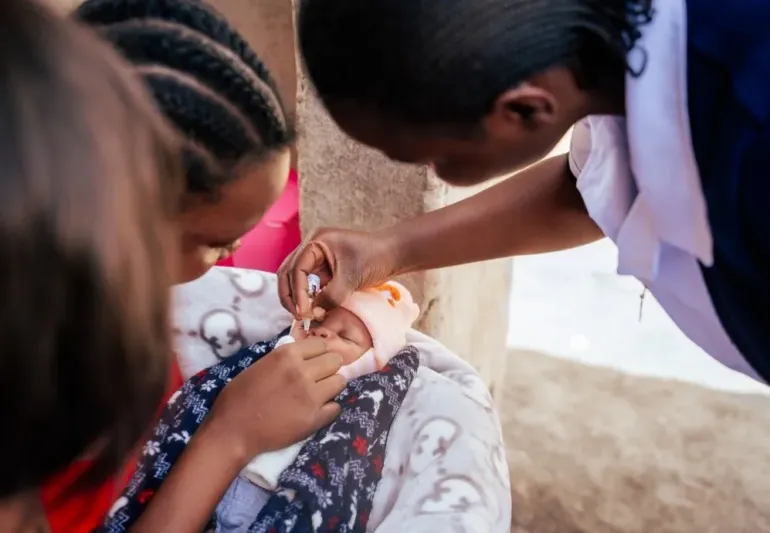 A newborn gets vaccinated against polio in Kanyama, Lusaka, during the second round of the polio subnational campaign, in June 2026