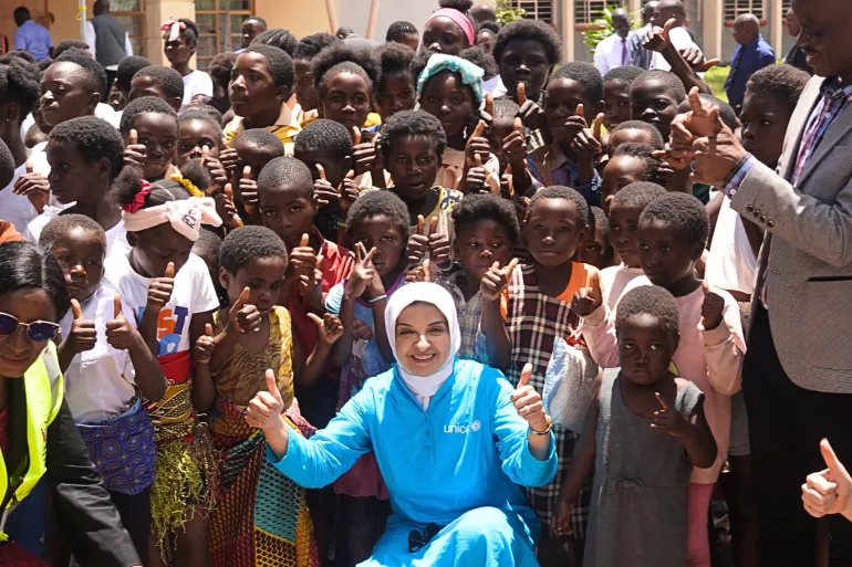 UNICEF Zambia Representative Dr. Saja Farooq Abdullah poses with children and community members during her familiarisation mission in Luapula Province.