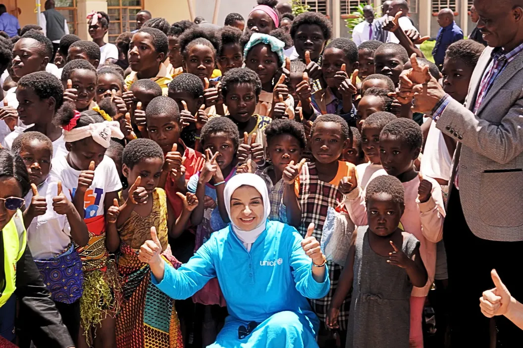 UNICEF Zambia Representative Dr. Saja Farooq Abdullah poses with children and community members during her familiarisation mission in Luapula Province.