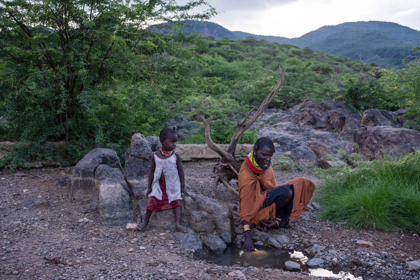 Mother sits with child