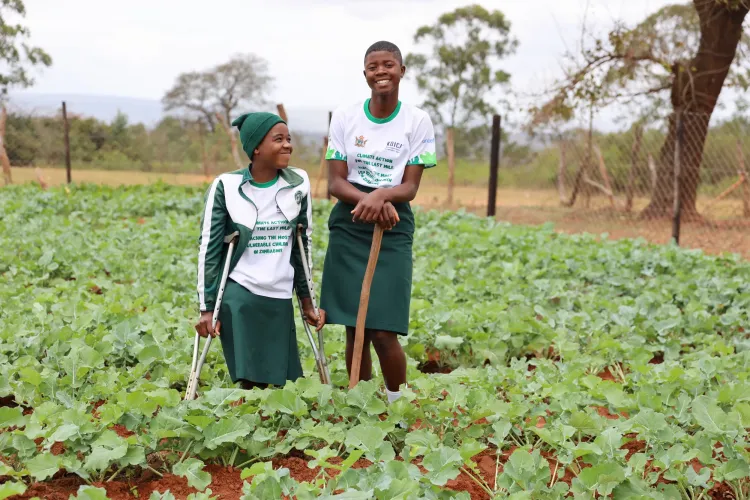 euna and friend in the nutrition garden