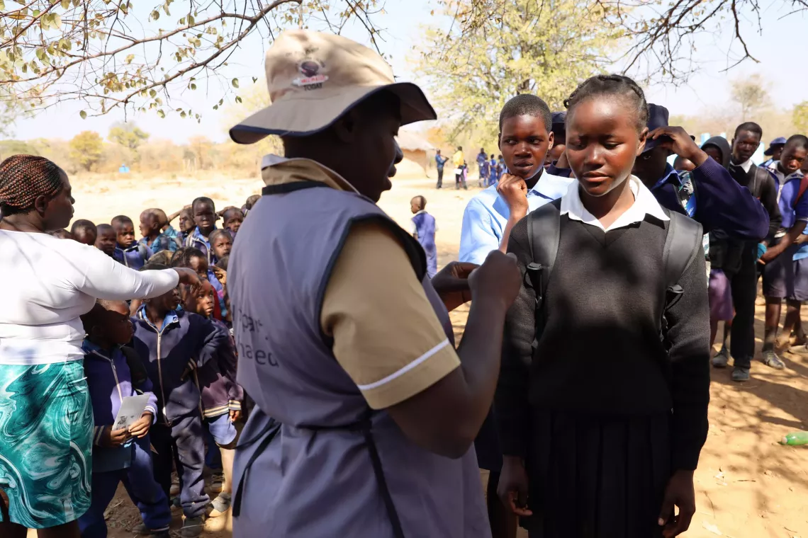 Adolescent girls lining up to receive HPV Vaccine