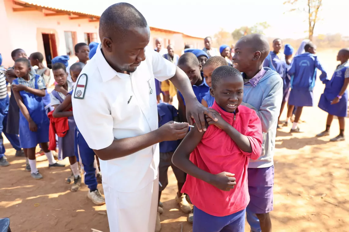 A boy receiving Td vaccine at an intergrated health outreach point