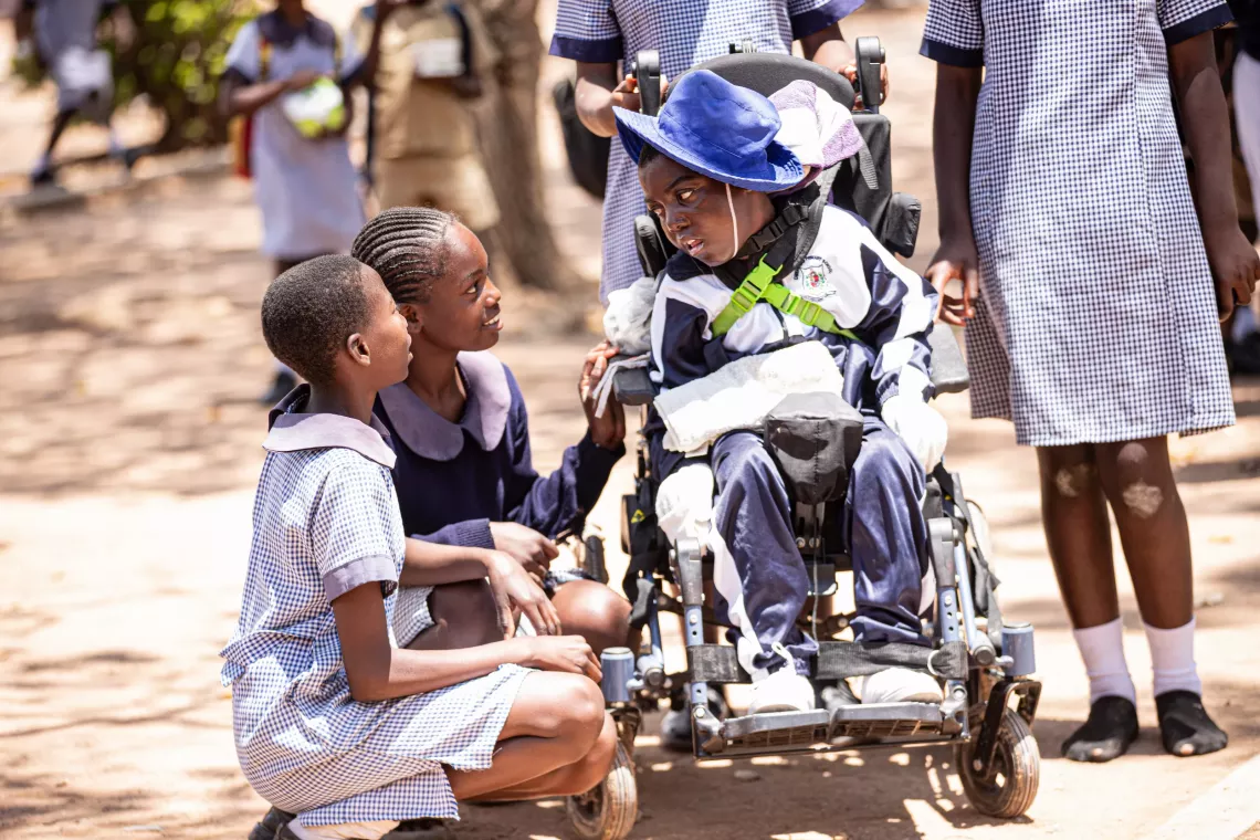 Child with disability interacts with children in their school