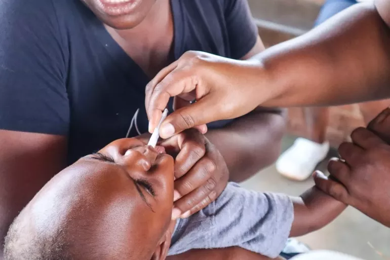 Child receiving Cholera vaccine